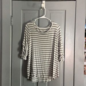 gray and white shirt with ruffled sleeves